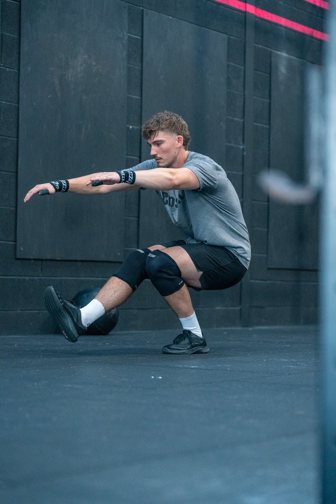 An illustration explaining the modern workout regime known as 'Murph' in Crossfit. This scene should depict both a male and female athlete of diverse ethnic backgrounds (one Caucasian and one Black) e