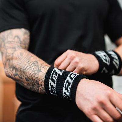 Murgs black sweatband wristband on athlete in Crossfit