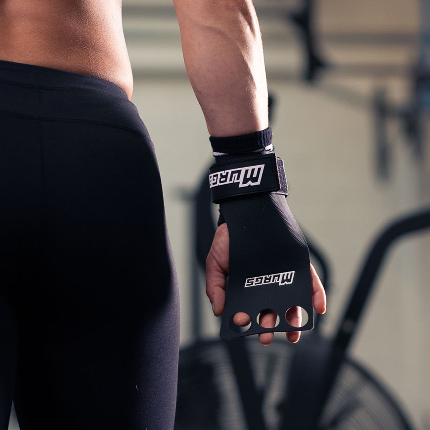 Athlete wearing Murgs Panther Grips ULTRA 3 hole crossfit grips