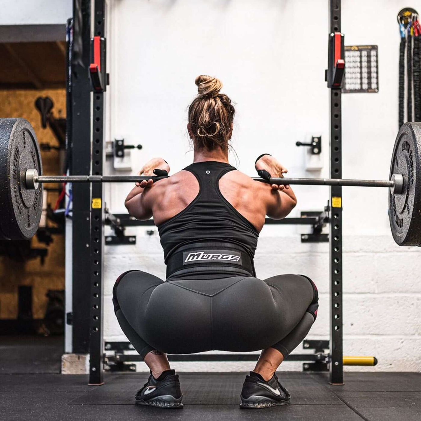 Athlete front squatting in the 5 inch Murgs weightlifting belt